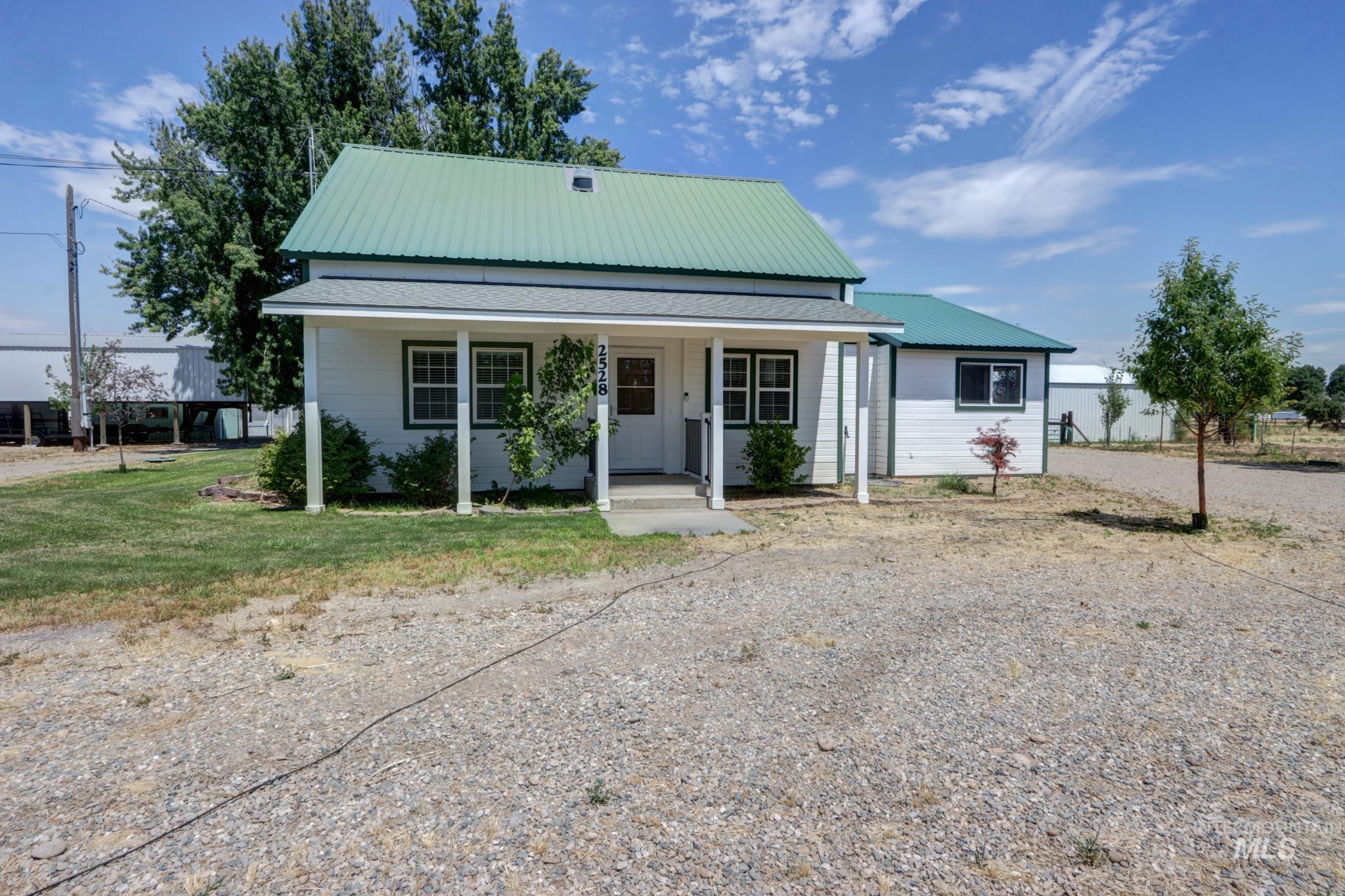 2528 Waterwheel Road Emmett, ID 83617 - Photo 11 of 50 Kitchen featuring gray cabinetry, white subway tile backsplash, stainless steel appliances, and light-toned flooring