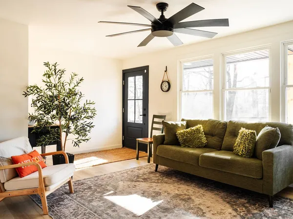 a living room with furniture and a large window