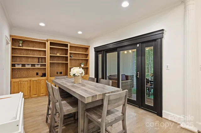 a dining room with a table and chairs