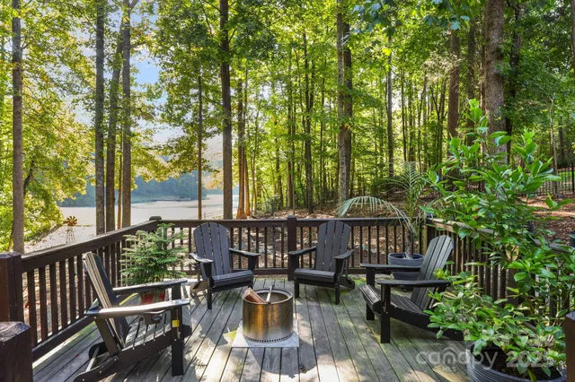 a view of a patio with iron fence
