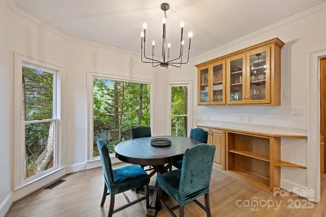 a view of a dining room with furniture window and outside view
