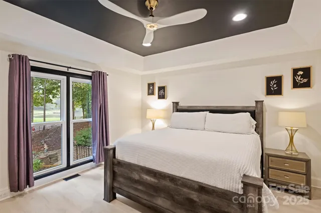 a bedroom with a bed and a tv