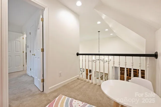 a bathroom with a sink mirror vanity and toilet