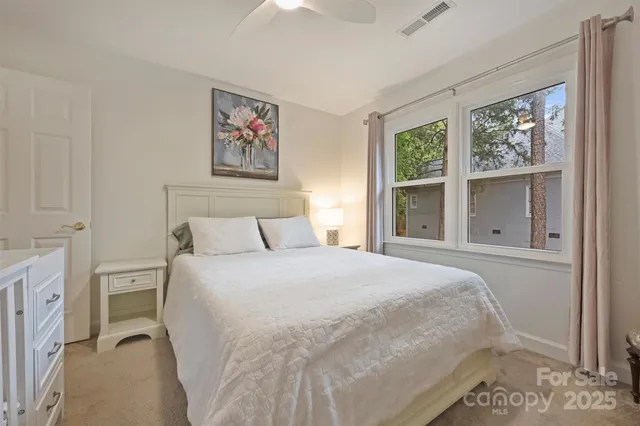 a bathroom with a granite countertop toilet a sink and a bathtub