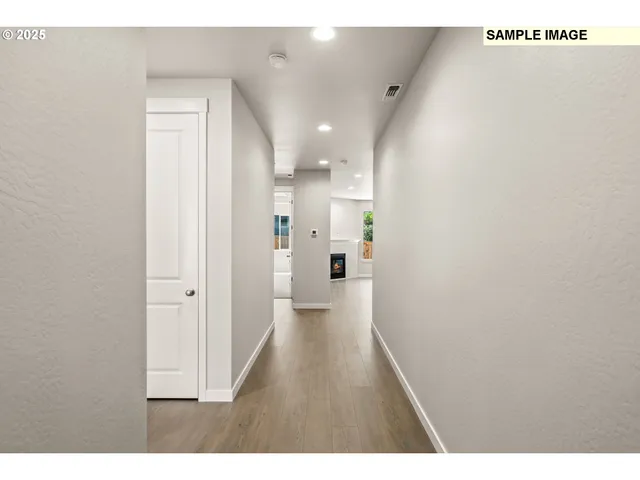 a hallway with a wooden floor