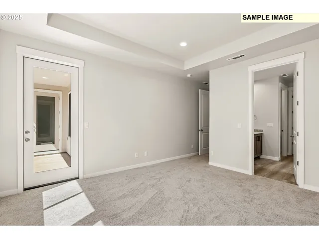 a view of an empty room and fire place