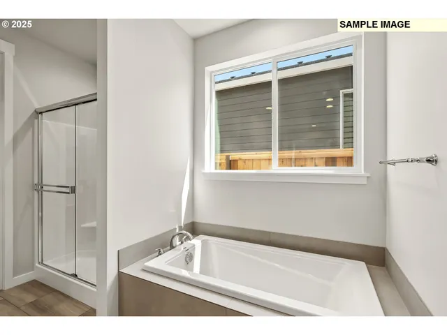 a bath tub sitting next to a window