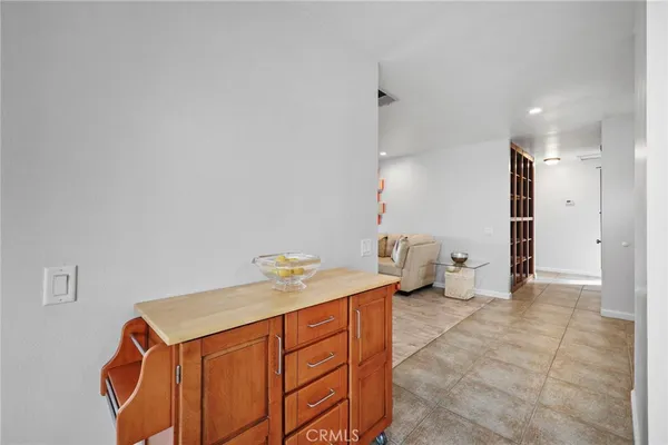 a view of empty room with wooden floor and windows