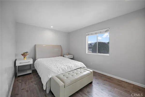 a bedroom with a bed and a couch