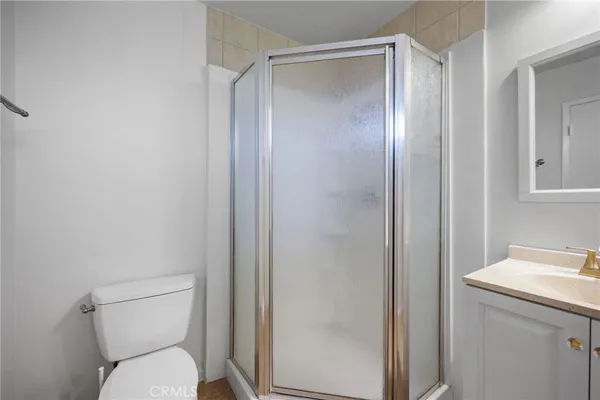 a patio with garden area and outdoor seating