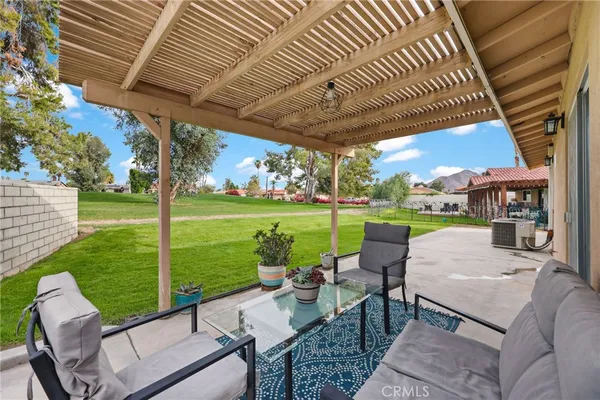 a patio with table and chairs