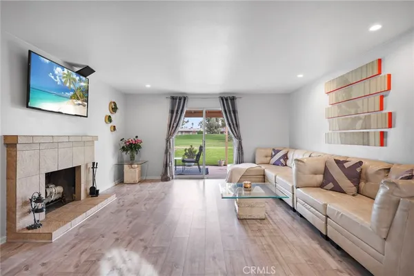 a living room with furniture and a fireplace
