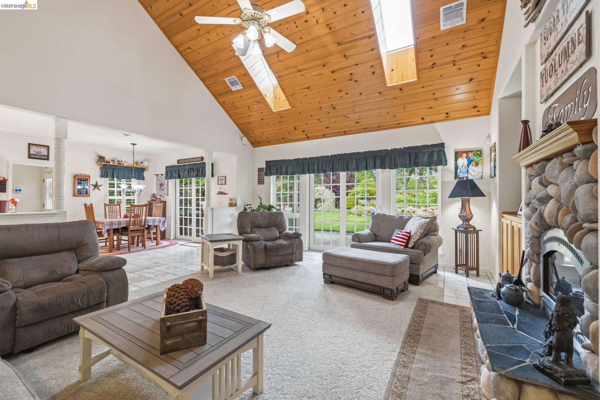 18450 Lambert Lake Road Sonora, CA 95370 - Photo 40 of 87 Vaulted wood-finish ceiling with skylights and ceiling fan