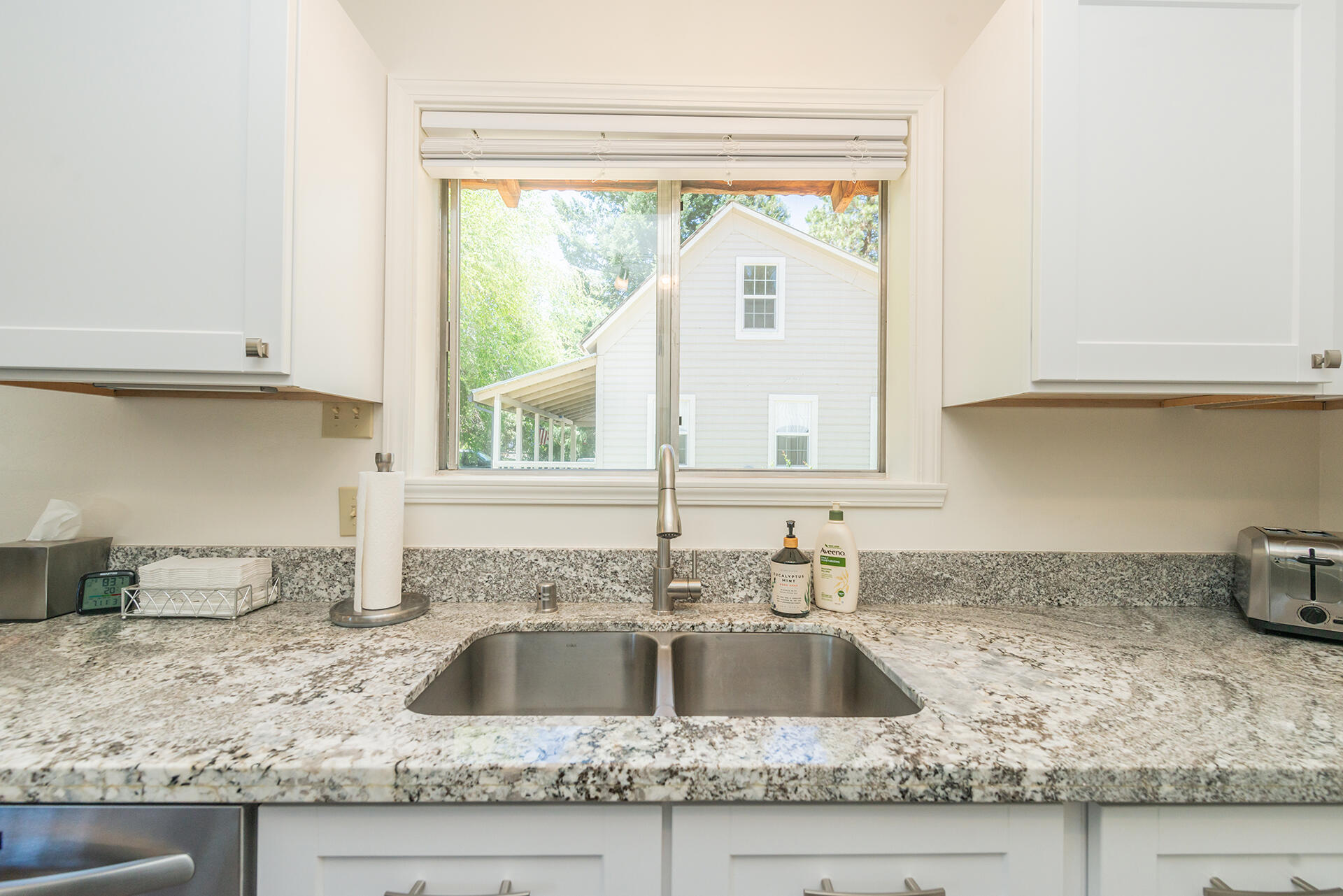 111 Scott Trinity Center Trinity Center, CA 96091 - Photo 12 of 46 a kitchen with granite countertop a sink and a window