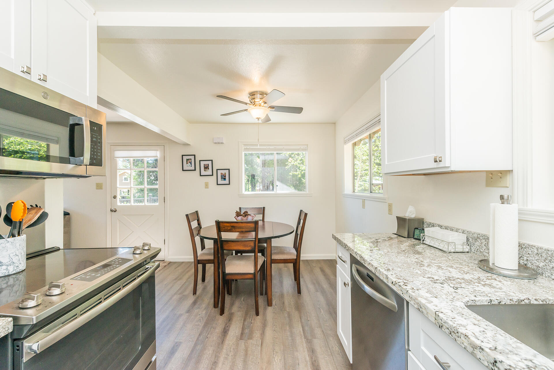 111 Scott Trinity Center Trinity Center, CA 96091 - Photo 20 of 46 a kitchen with stainless steel appliances granite countertop a stove a sink and a refrigerator