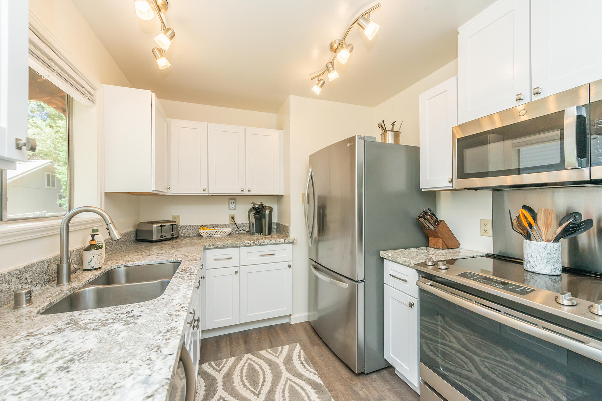 111 Scott Trinity Center Trinity Center, CA 96091 - Photo 2 of 46 a kitchen with stainless steel appliances granite countertop a sink stove refrigerator and cabinets