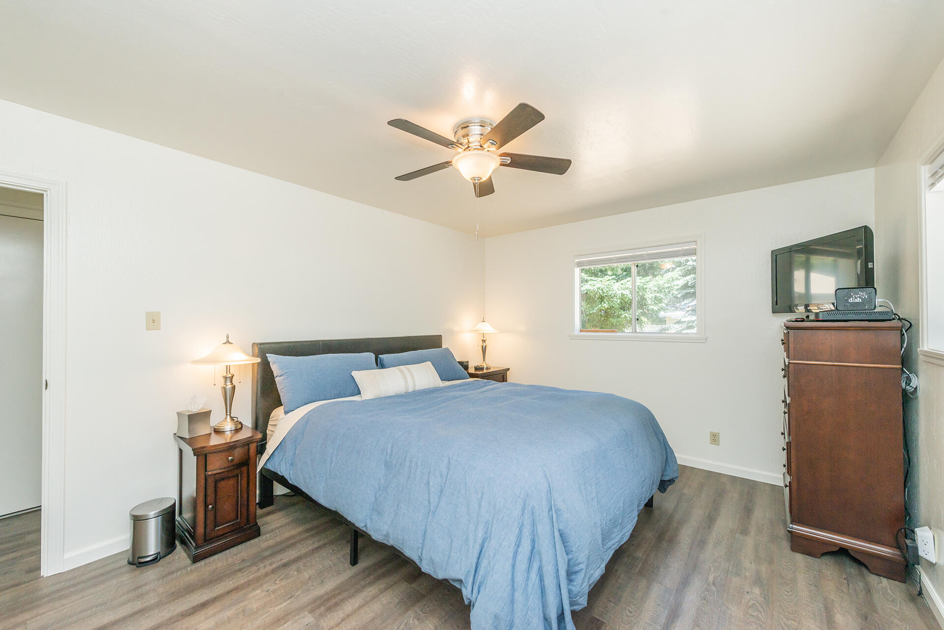 111 Scott Trinity Center Trinity Center, CA 96091 - Photo 29 of 46 a bedroom with a bed and a chandelier