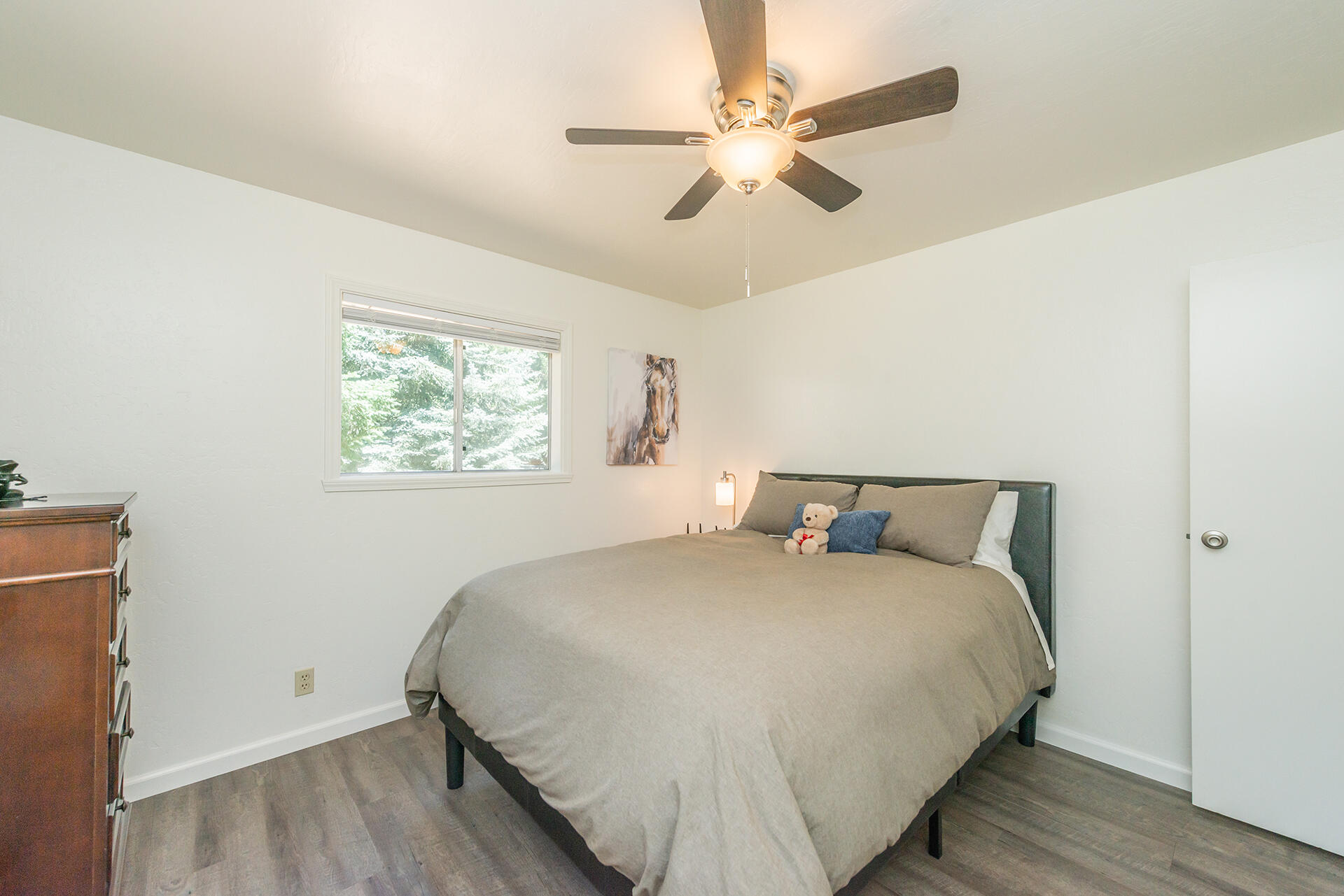 111 Scott Trinity Center Trinity Center, CA 96091 - Photo 31 of 46 a bedroom with a large bed and a ceiling fan