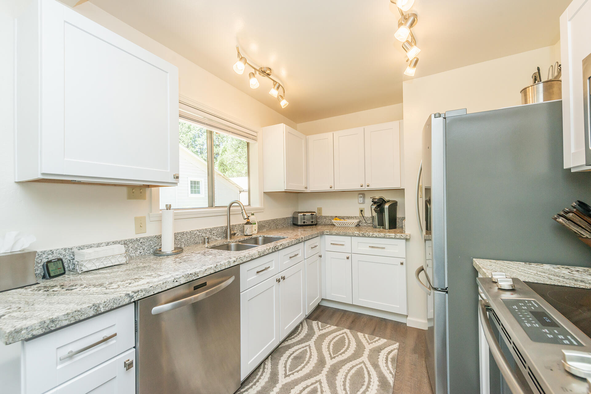 111 Scott Trinity Center Trinity Center, CA 96091 - Photo 8 of 46 a kitchen with a sink stove and refrigerator