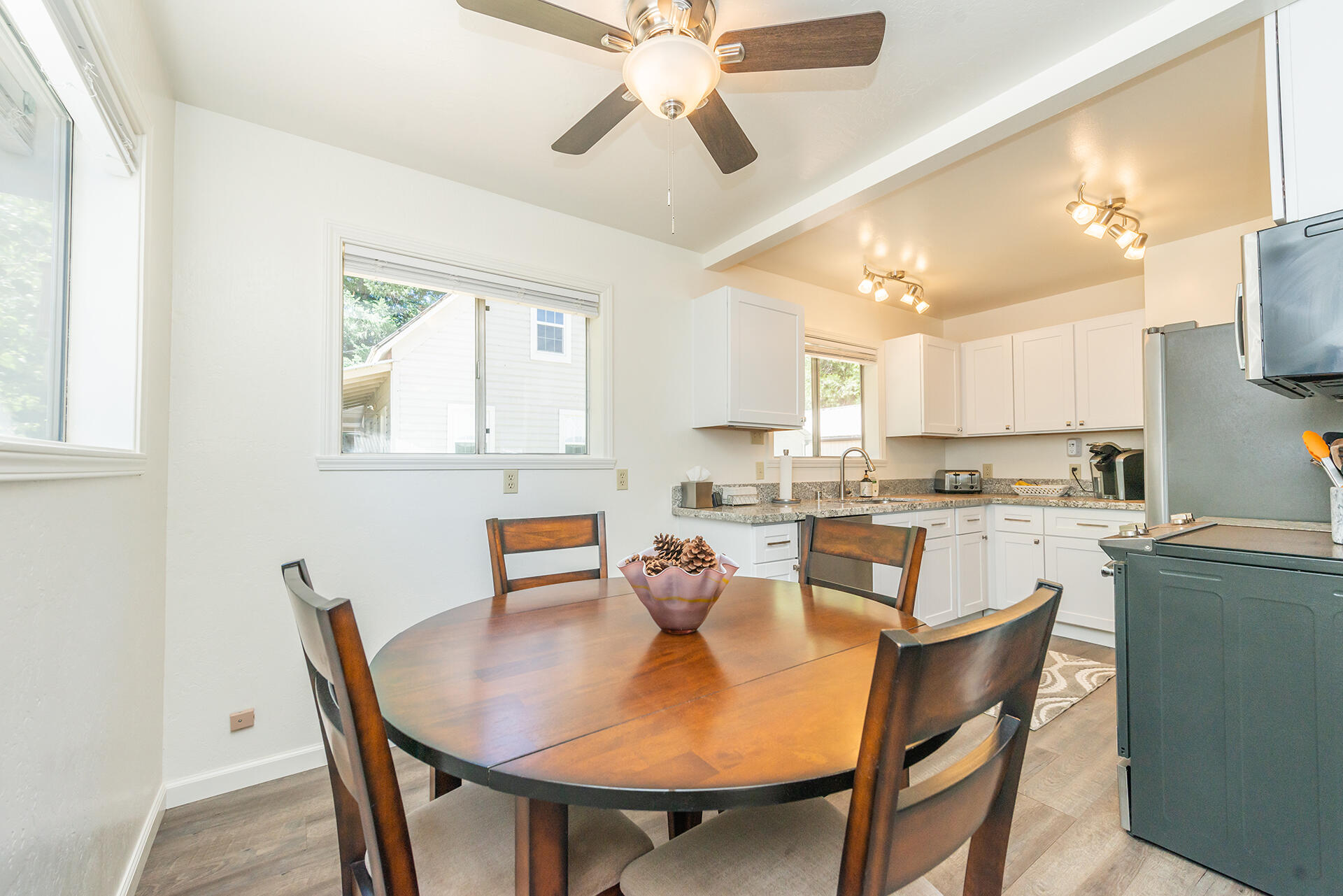 111 Scott Trinity Center Trinity Center, CA 96091 - Photo 9 of 46 a dining room with a table chairs and a kitchen view