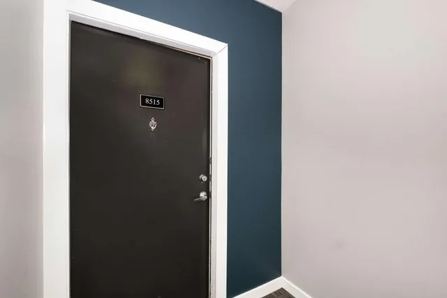 a row of building with cars parked in front of it