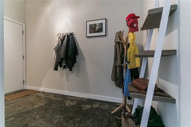 a view of a patio with a table and chairs under an umbrella