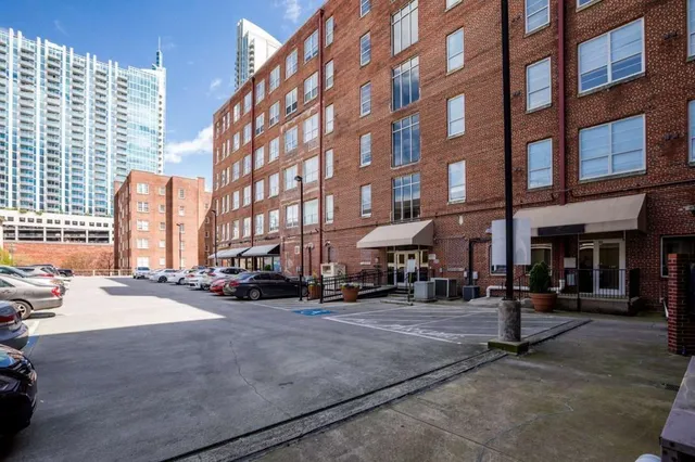 a view of a water fountain and a bench in the patio