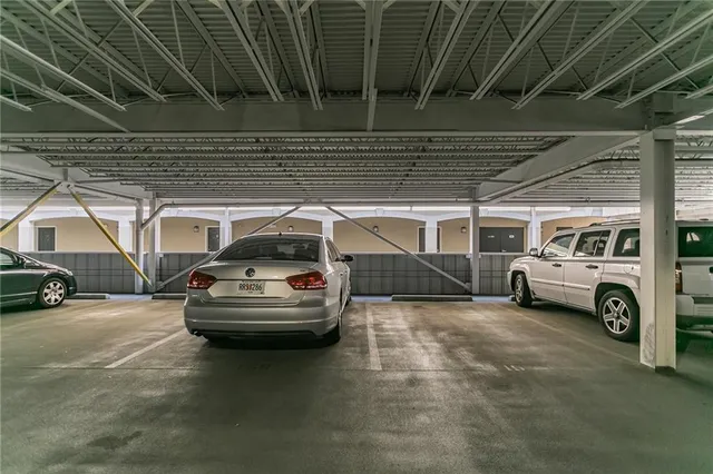 a view of swimming pool with outdoor seating and a garden