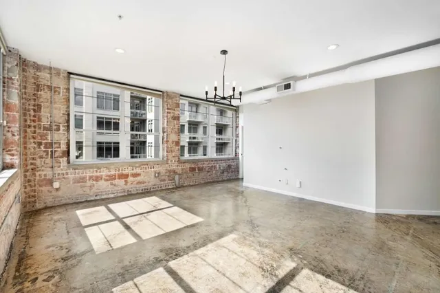 a bathroom with a window and a shower