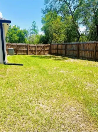 a view of a backyard with a small swimming pool