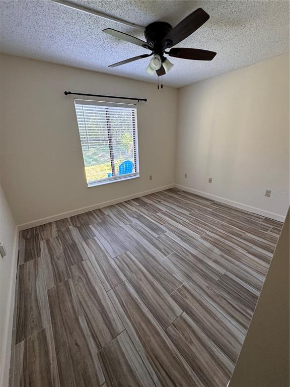 1372 Pine Ridge Circle East, Unit F1 Tarpon Springs, FL 34688 - Photo 12 of 21 a view of an empty room with a window