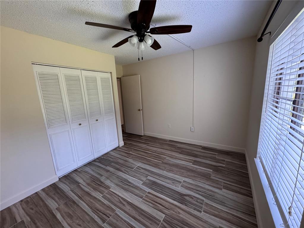 1372 Pine Ridge Circle East, Unit F1 Tarpon Springs, FL 34688 - Photo 13 of 21 a view of an empty room with a window
