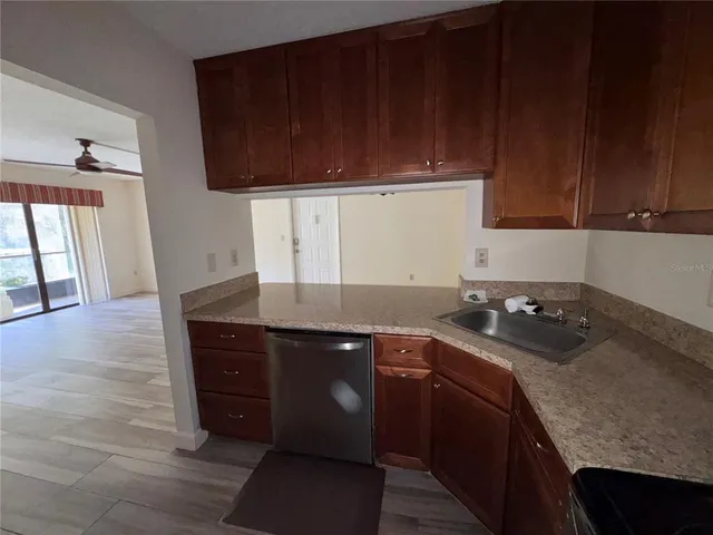 a kitchen with a sink and cabinets