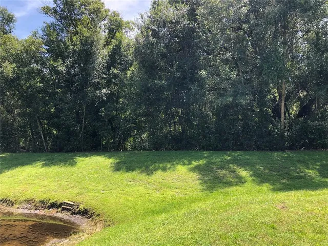 a view of a swimming pool with an outdoor space and seating area
