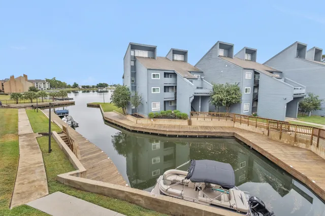 a view of swimming pool with outdoor seating and city view