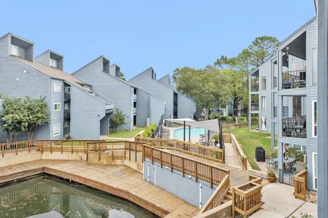 a view of a swimming pool with a patio