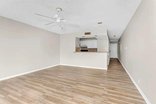 a view of a kitchen with a sink dishwasher and a microwave
