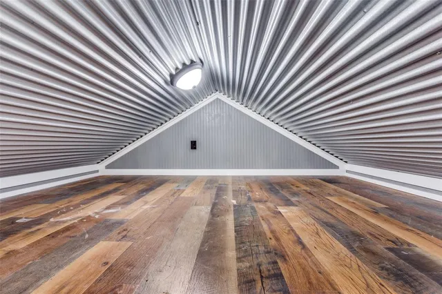 a view of backyard with white walls