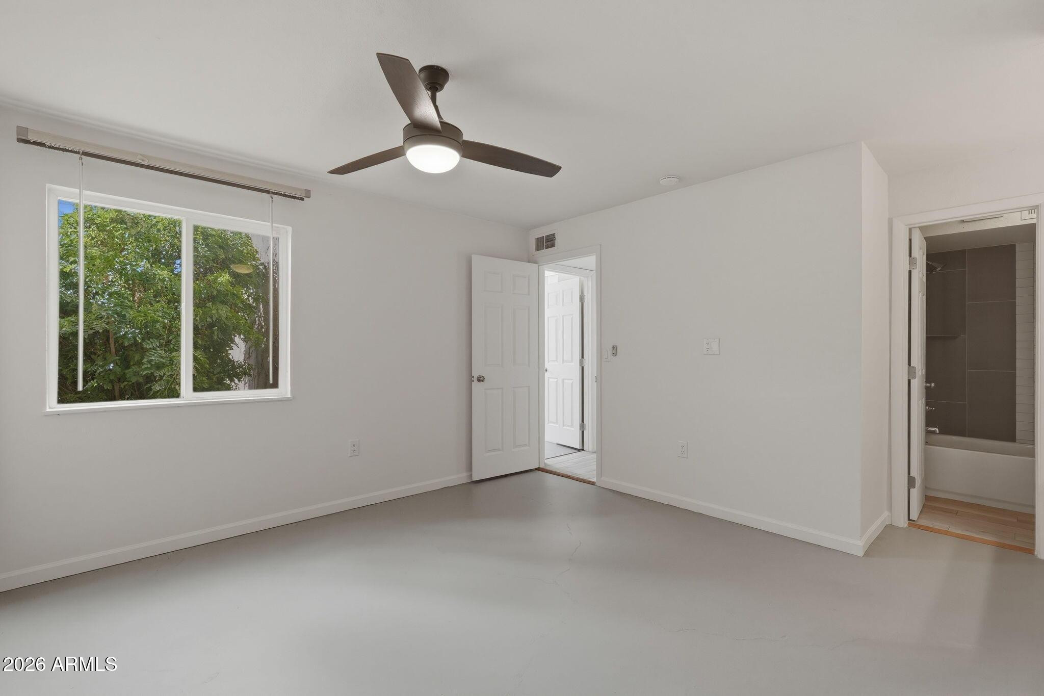 8055 East Thomas Road, Unit B107 Scottsdale, AZ 85251 - Photo 17 of 28 a view of an empty room with a window