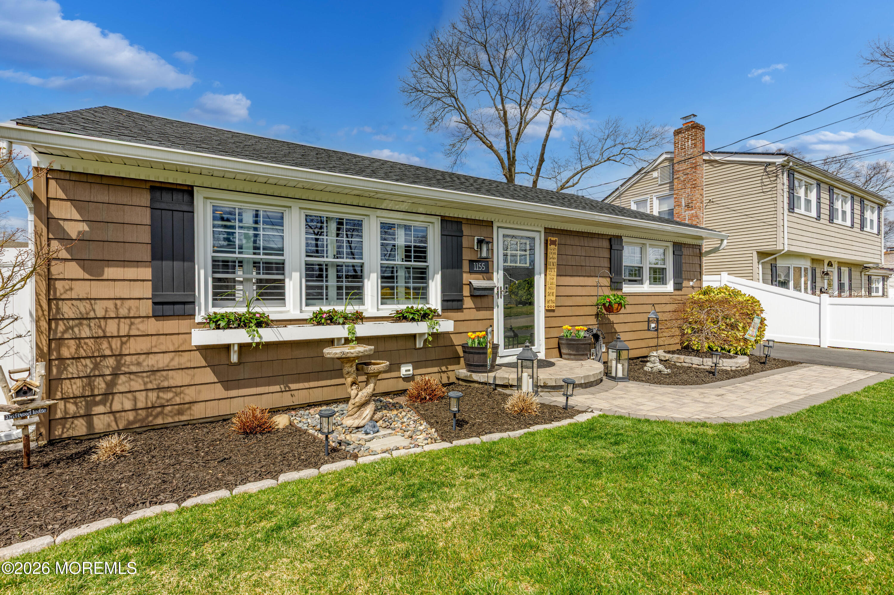 1155 Lockhart Lane Point Pleasant, NJ 08742 - Photo 1 of 33 a front view of a house with patio