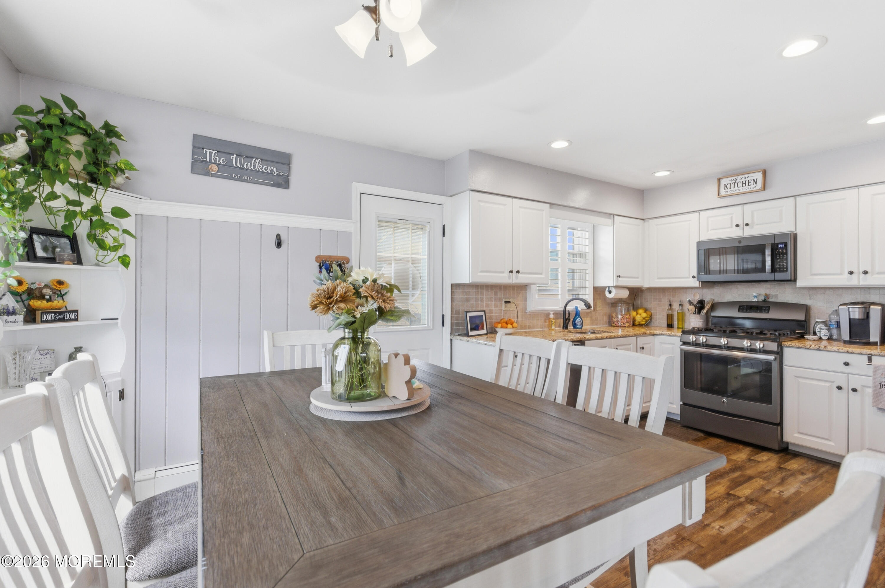 1155 Lockhart Lane Point Pleasant, NJ 08742 - Photo 13 of 33 a kitchen with a table and chairs in it