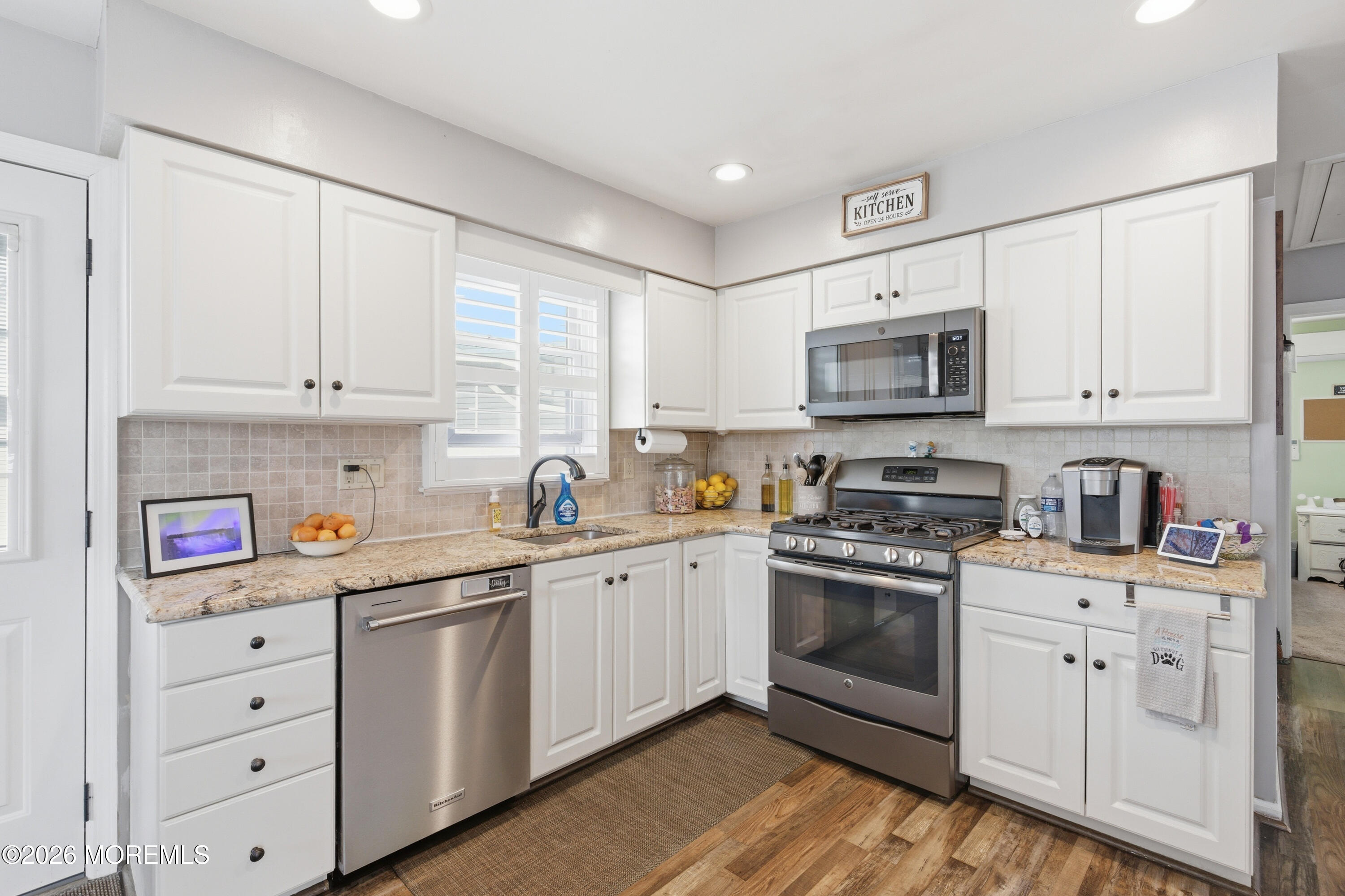 1155 Lockhart Lane Point Pleasant, NJ 08742 - Photo 14 of 33 a kitchen with cabinets stainless steel appliances a sink and a window