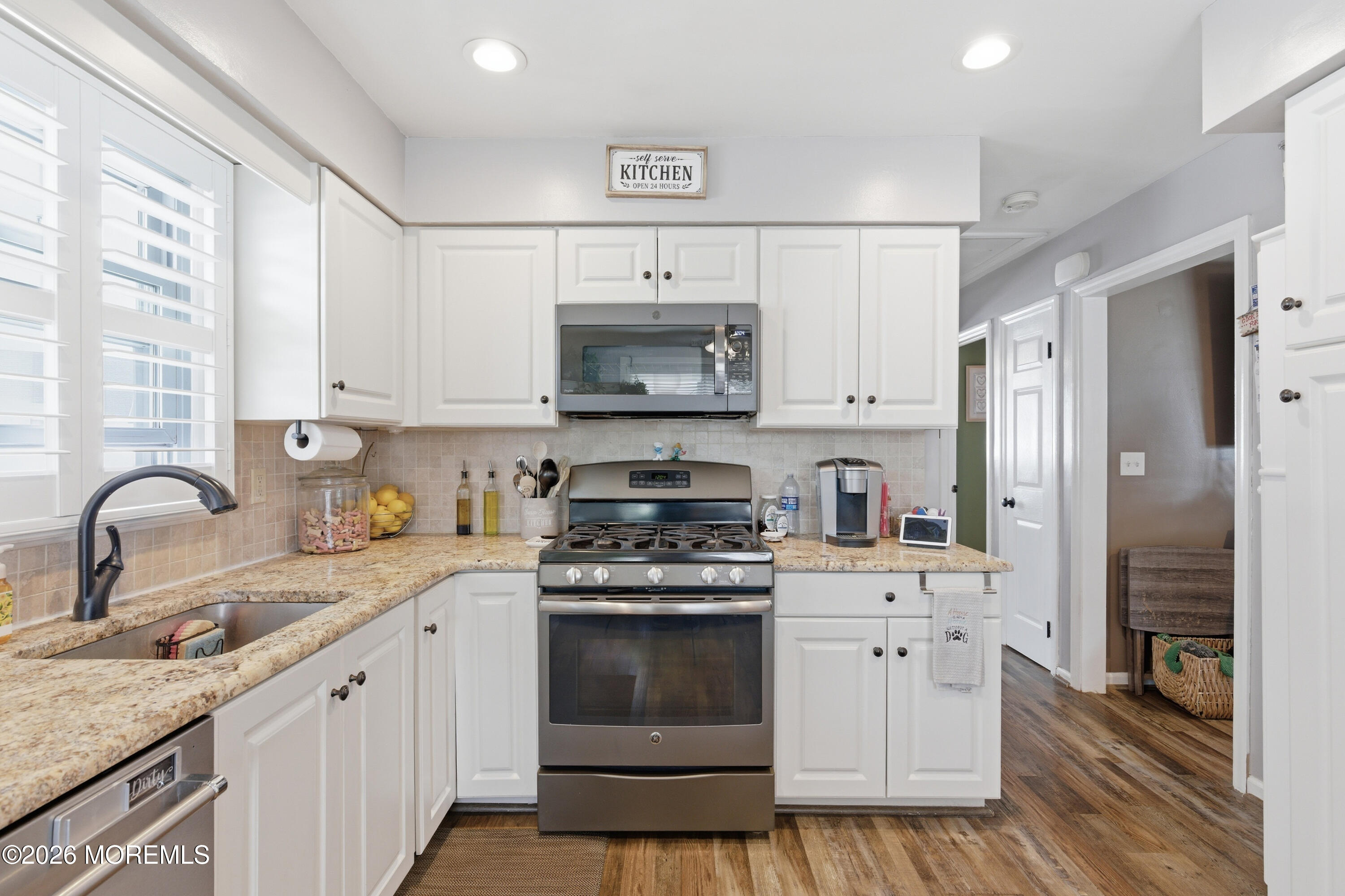 1155 Lockhart Lane Point Pleasant, NJ 08742 - Photo 15 of 33 a kitchen with stainless steel appliances granite countertop a stove sink and refrigerator