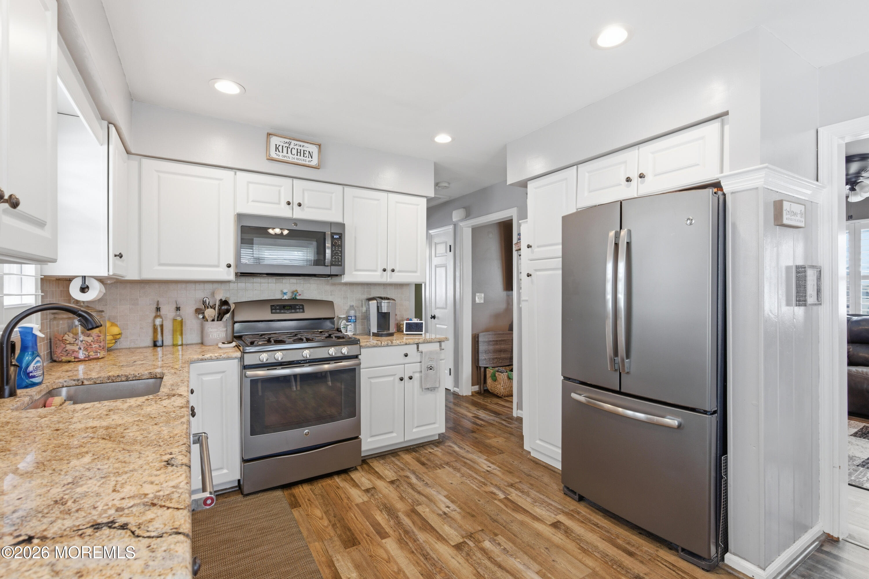 1155 Lockhart Lane Point Pleasant, NJ 08742 - Photo 18 of 33 a kitchen with stainless steel appliances a refrigerator sink and microwave