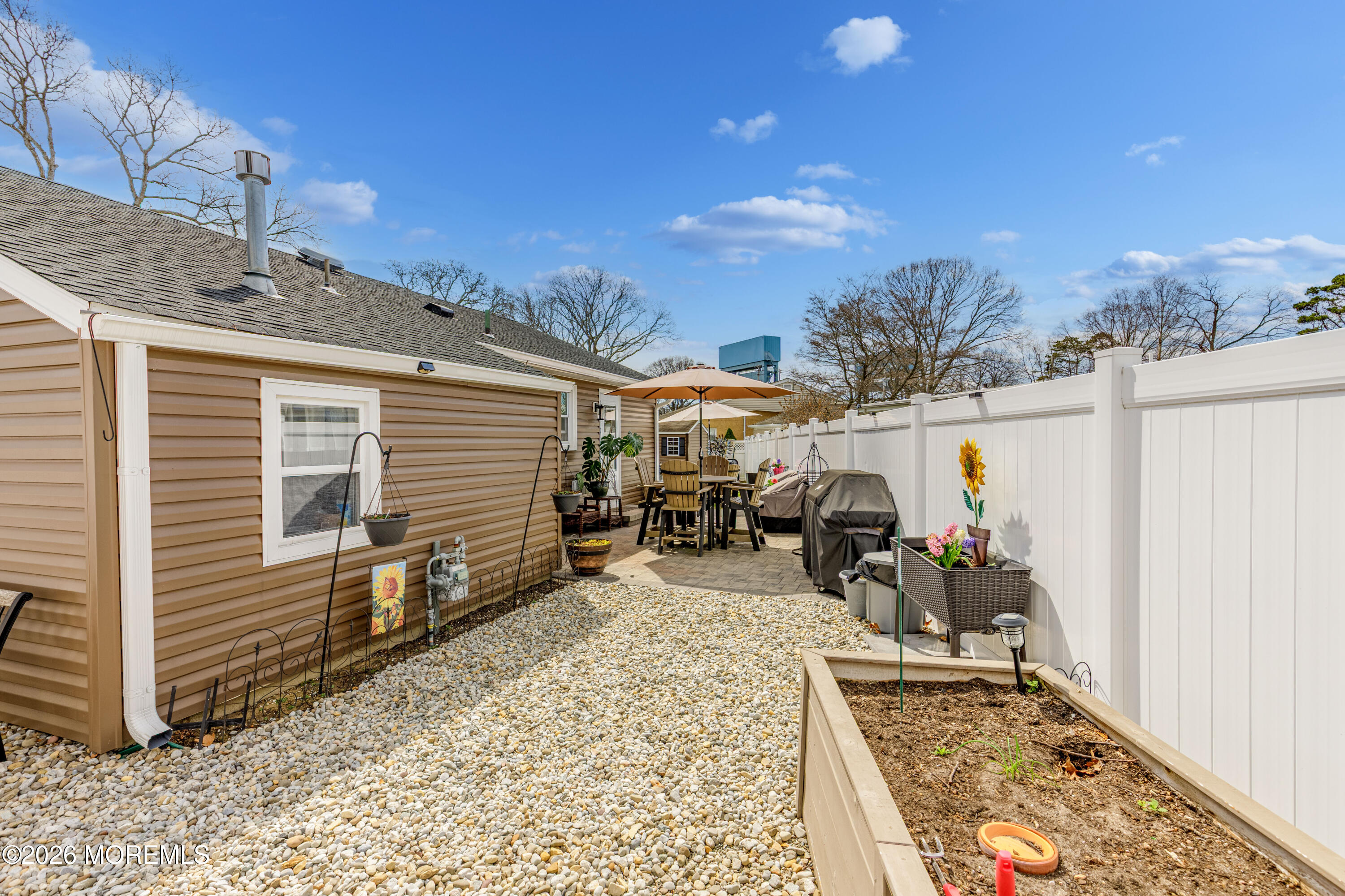 1155 Lockhart Lane Point Pleasant, NJ 08742 - Photo 30 of 33 a view of a house with a patio