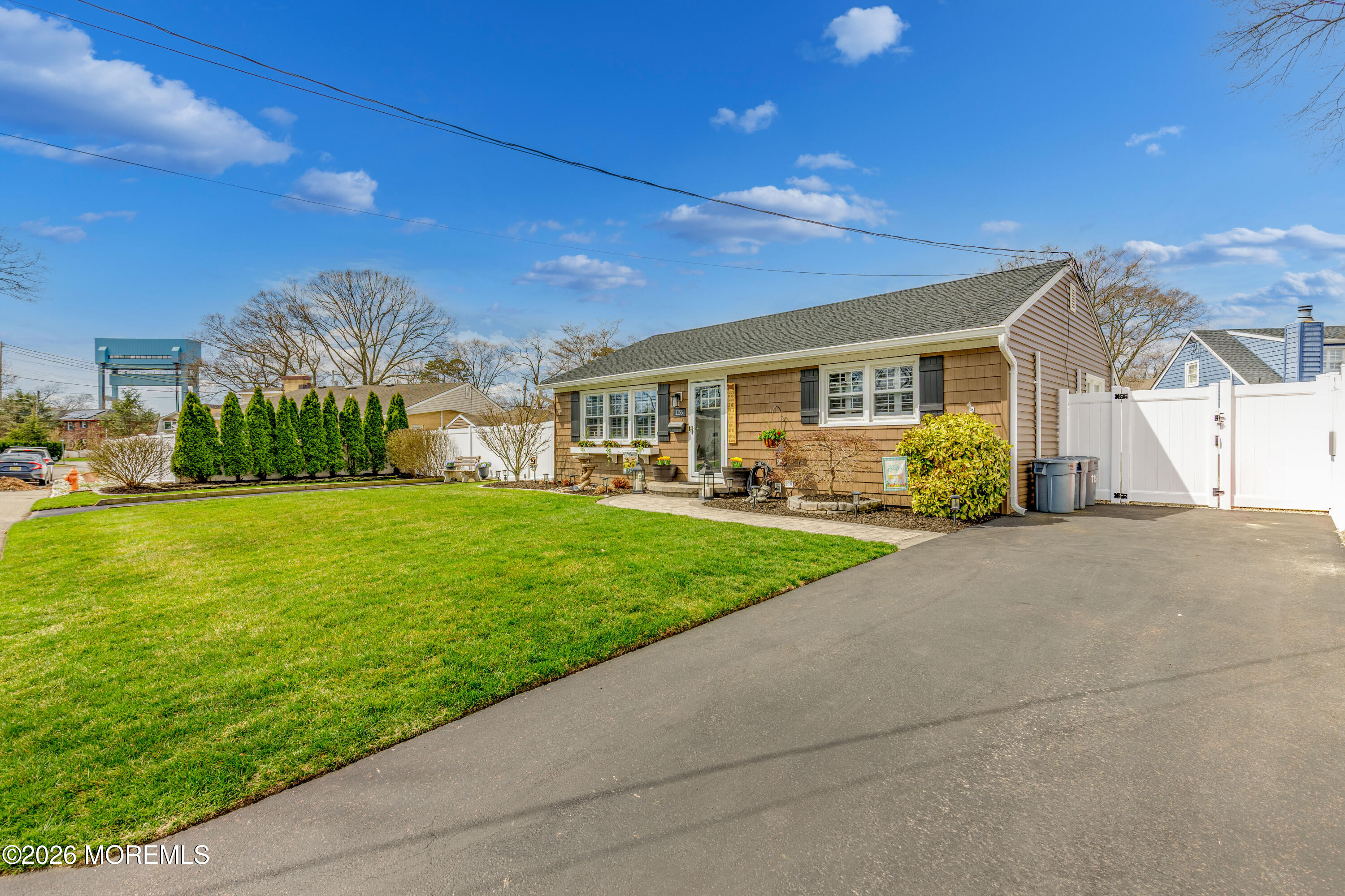 1155 Lockhart Lane Point Pleasant, NJ 08742 - Photo 6 of 33 a front view of house with yard and green space