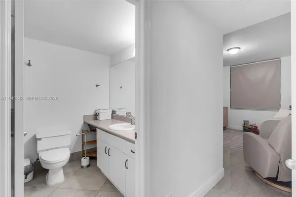 a bedroom with a bed and a dresser in it