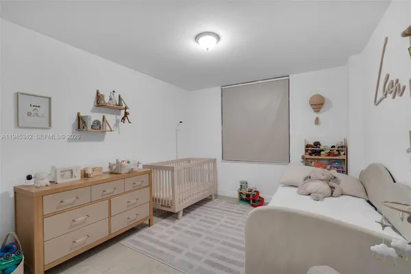 a bedroom with a bed and gym equipment