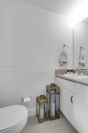 a view of a workspace with furniture and wooden floor