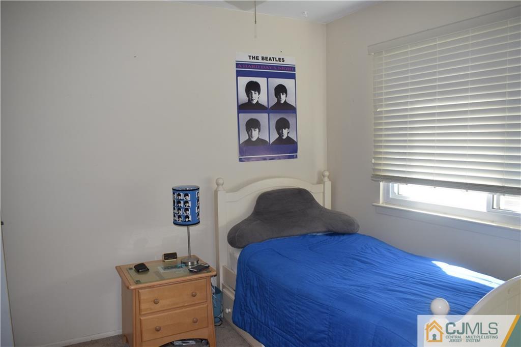 10 Harper Road Monmouth Junction, NJ 08852 - Photo 12 of 24 a bedroom with a bed and a window